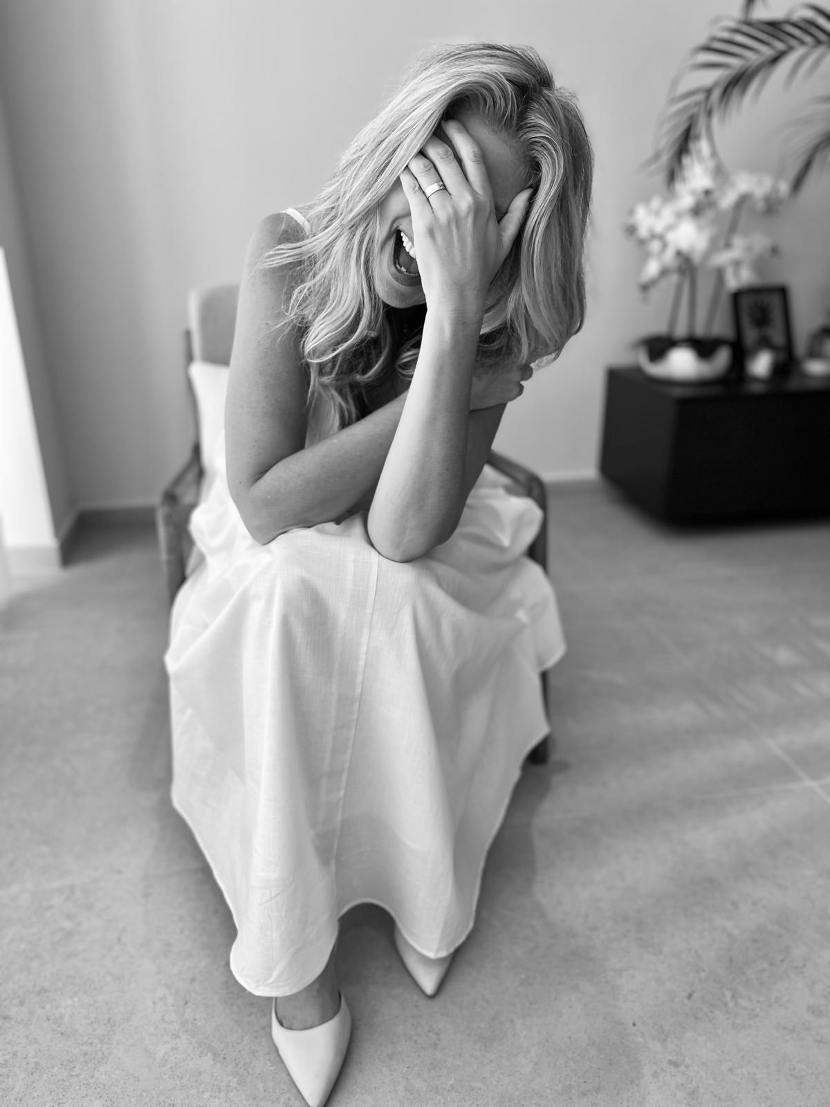 Gayle Berry seated, laughing